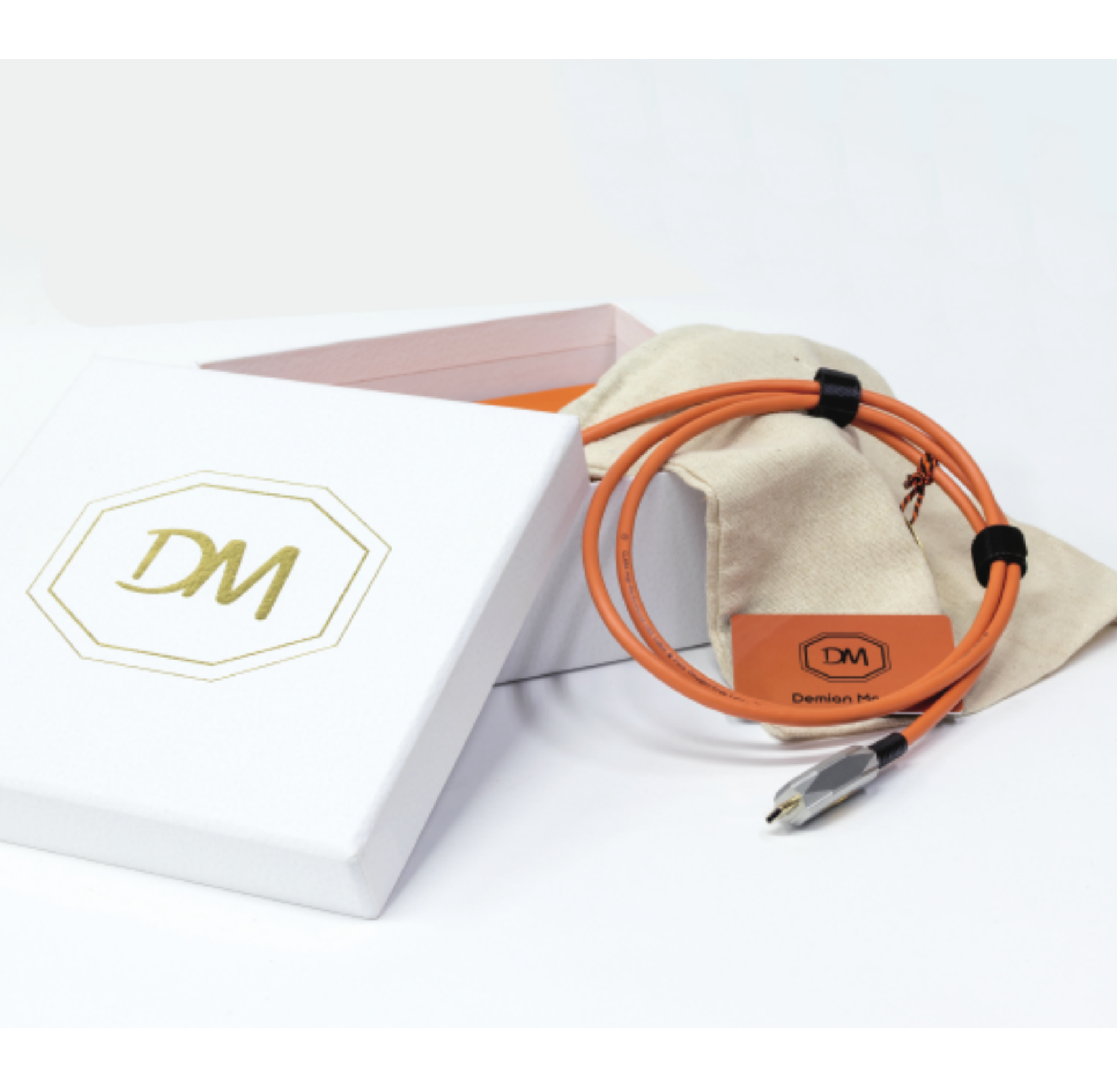 DMConnect orange cable, presentation box and fabric pouch from the cable collection brochure cover