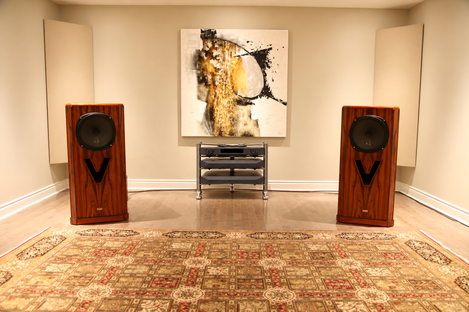 NuPrime Evolution Series system in a showroom between two wood-finished speakers